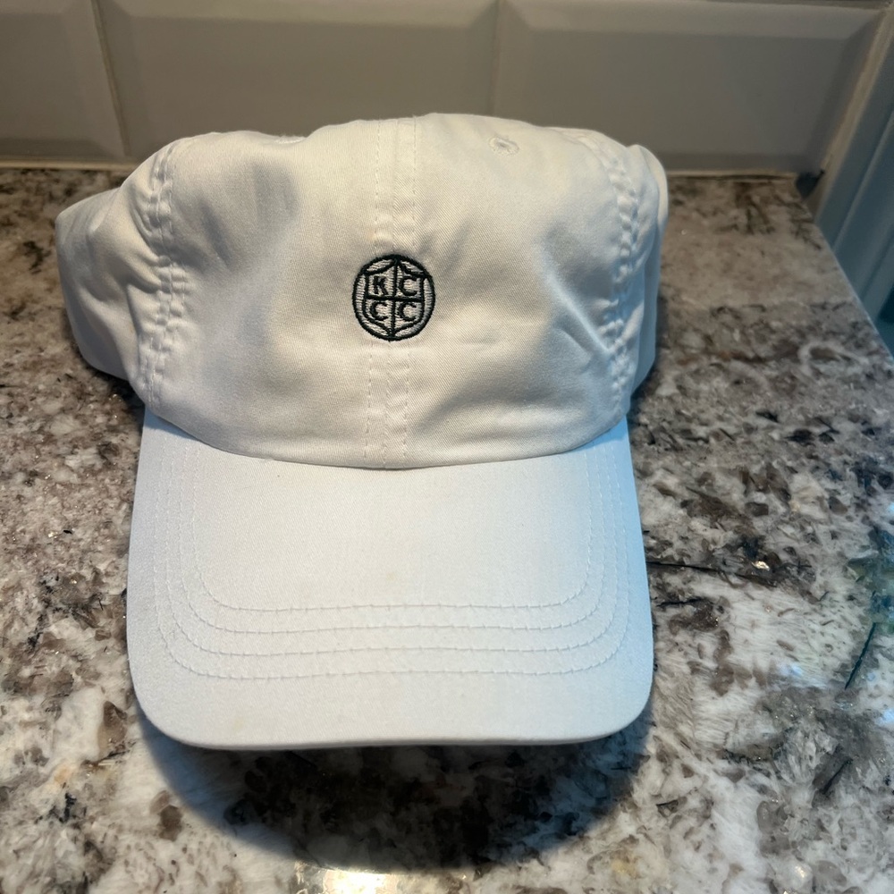 White adjustable golf hat. Green Kansas City country club logo. Barely worn.